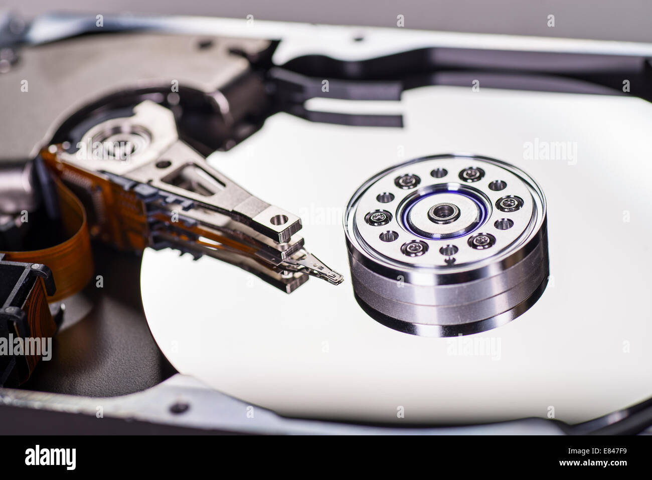 Detail of a opened hard disk with write head, read head and disk. Stock Photo