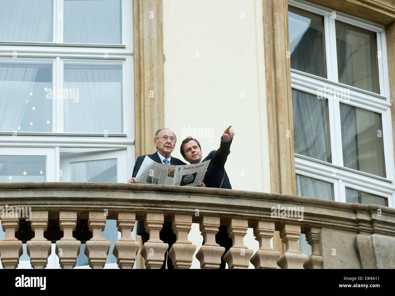 Prague, Czech Republic. 30th Sep, 2014. Former Foreign Minister and Vice Chancellor of Germany from 1974 to 1992 Hans-Dietrich Genscher (left) is seen at the balcony of the German embassy in Prague, Czech Republic, September 30, 2014. Hans-Dietrich Genscher attended the celebration of the 25th anniversary of the departure of thousands of refugees from Communist East Germany via the West German embassy in Prague to the West. © Vit Simanek/CTK Photo/Alamy Live News Stock Photo