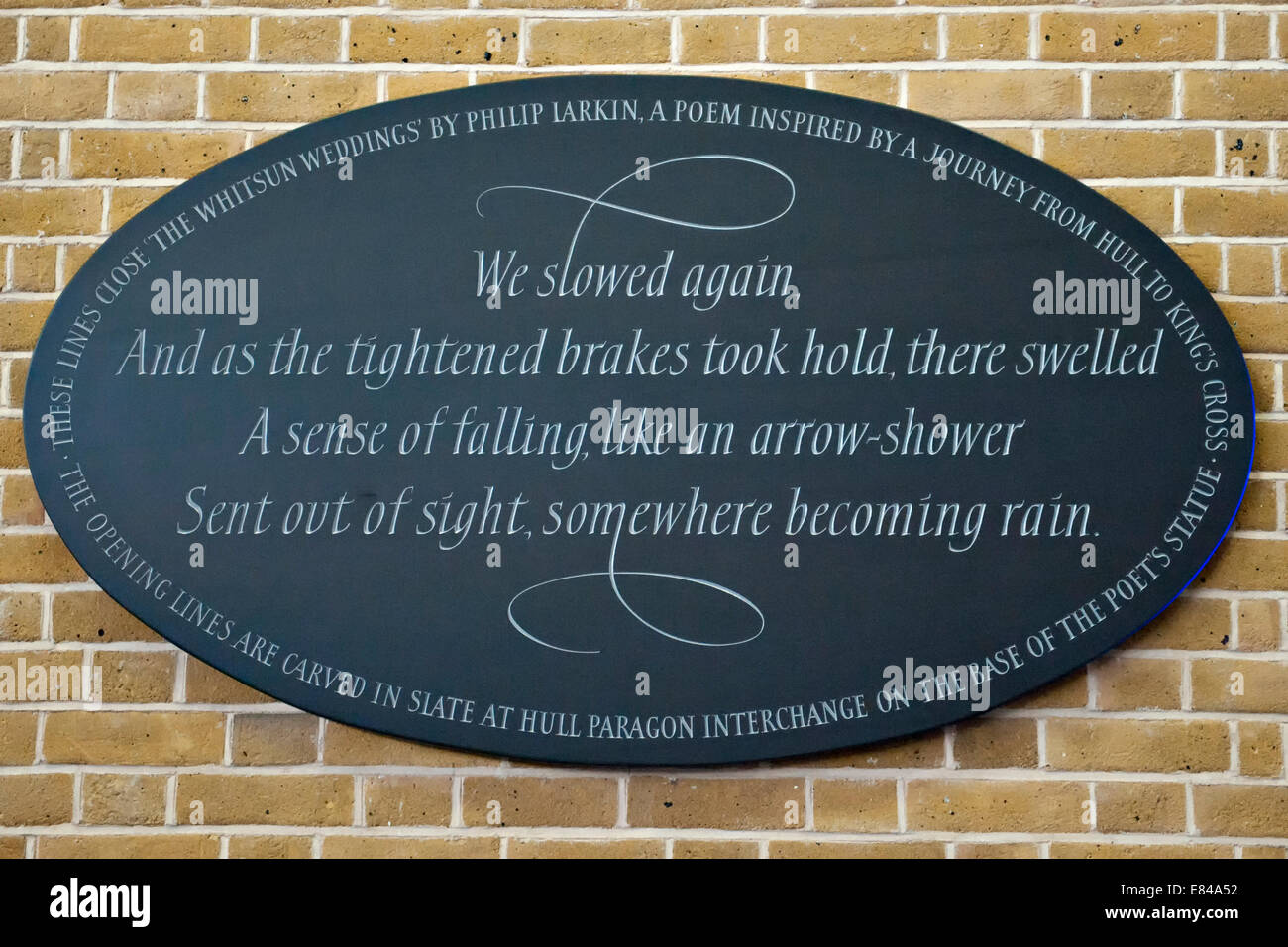 The King’s Cross Slate Ellipse with words from the final verse of Philip Larkin's 'The Whitsun Weddings'. Stock Photo