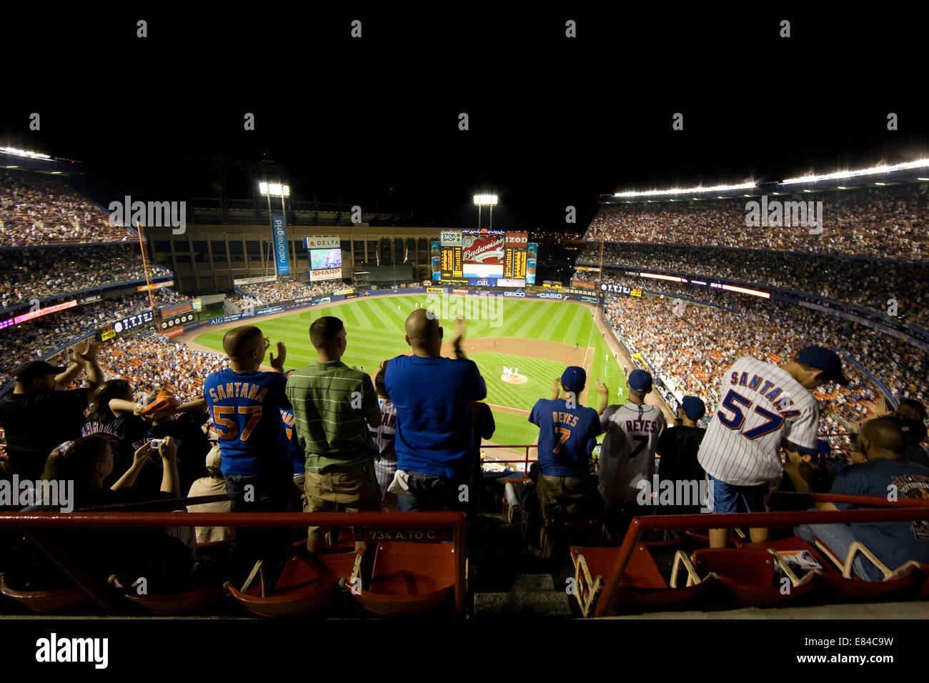 Spectators at a baseball game in the Mets stadium in New York City Stock Photo