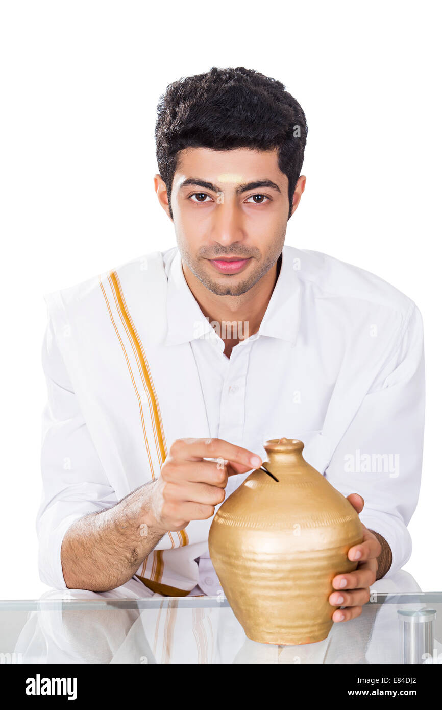 South Indian man saving money Piggy Bank Stock Photo - Alamy