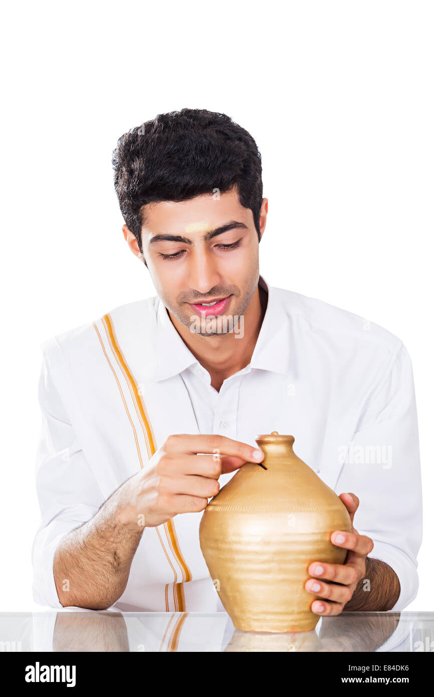 South Indian man saving money Piggy Bank Stock Photo - Alamy