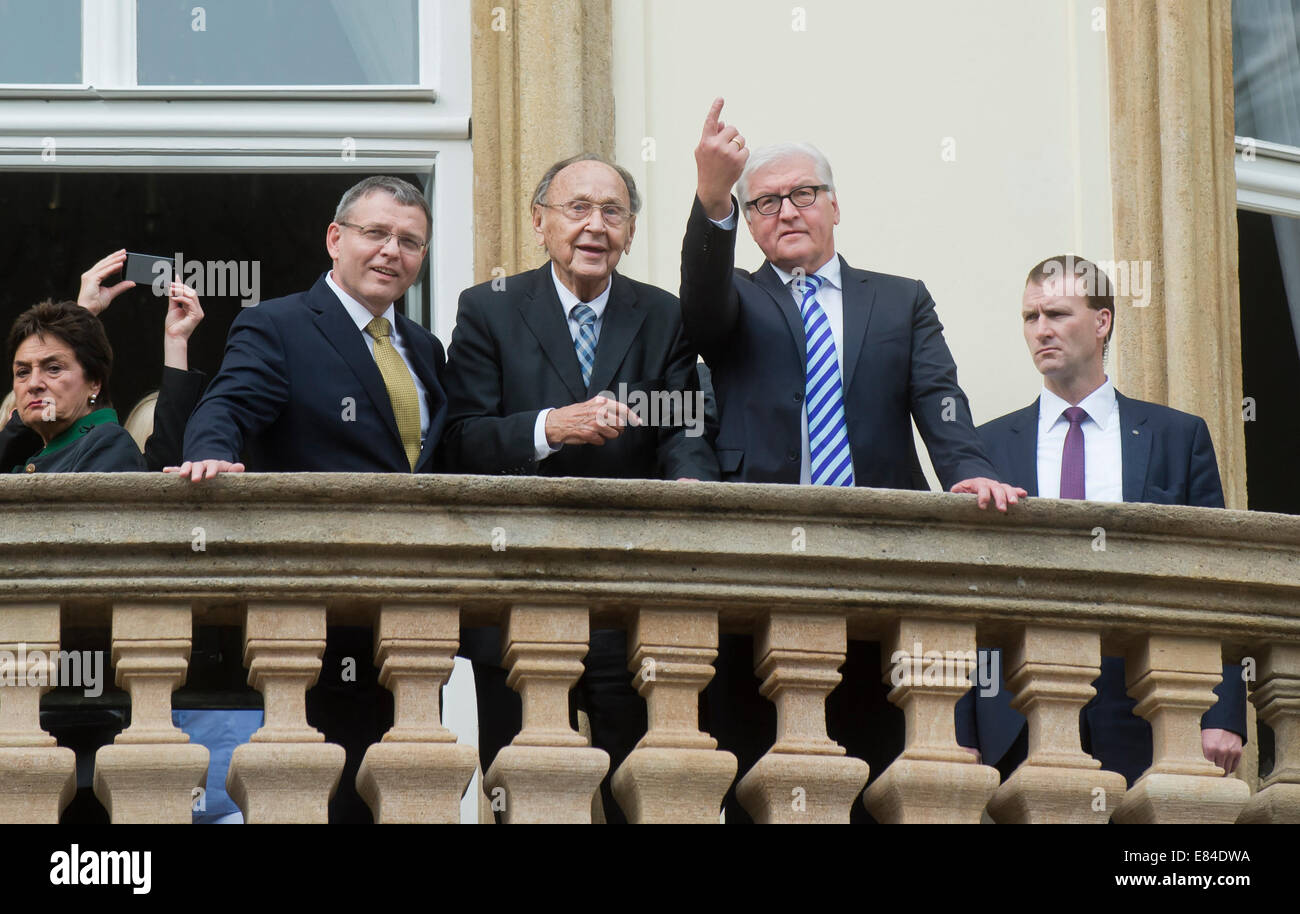 Former Foreign Minister and Vice Chancellor of Germany from 1974 to 1992 Hans-Dietrich Genscher (centre), Czech foreign minister Lubomir Zaoralek (next to him on the left) and German Minister for Foreign Affairs Frank-Walter Steinmeier (right) are seen on the balcony of the German embassy in Prague, Czech Republic, September 30, 2014. They attended the celebration of the 25th anniversary of the departure of thousands of refugees from Communist East Germany via the West German embassy in Prague to the West. (CTK Photo/Vit Simanek) Stock Photo