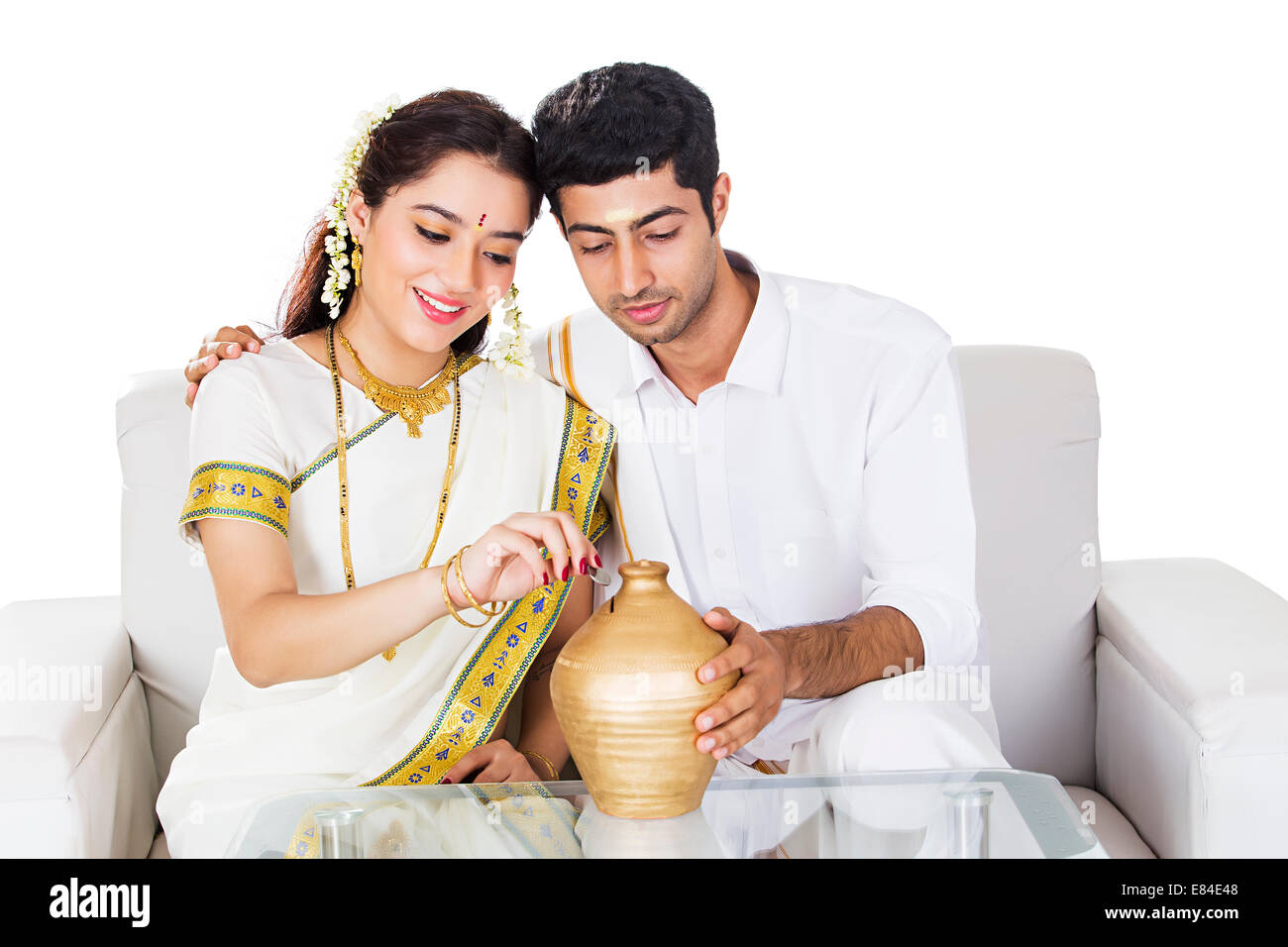 South Indian Couple saving money Piggy Bank Stock Photo - Alamy