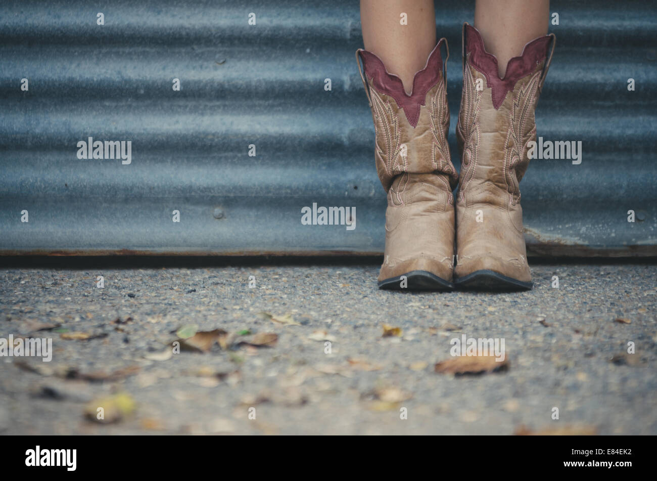 young girl with cowboy boots Stock Photo Alamy