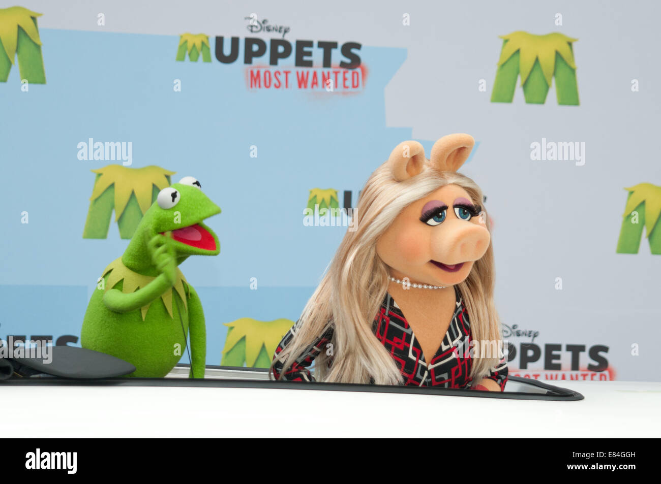 James Bobin, Miss Piggy and Kermit coming in XXL Trabant to promote the new 'The Muppets Most Wanted' Movie at Sony Center  Featuring: Kermit,Miss Piggy Where: Berlin, Germany When: 28 Mar 2014 Stock Photo