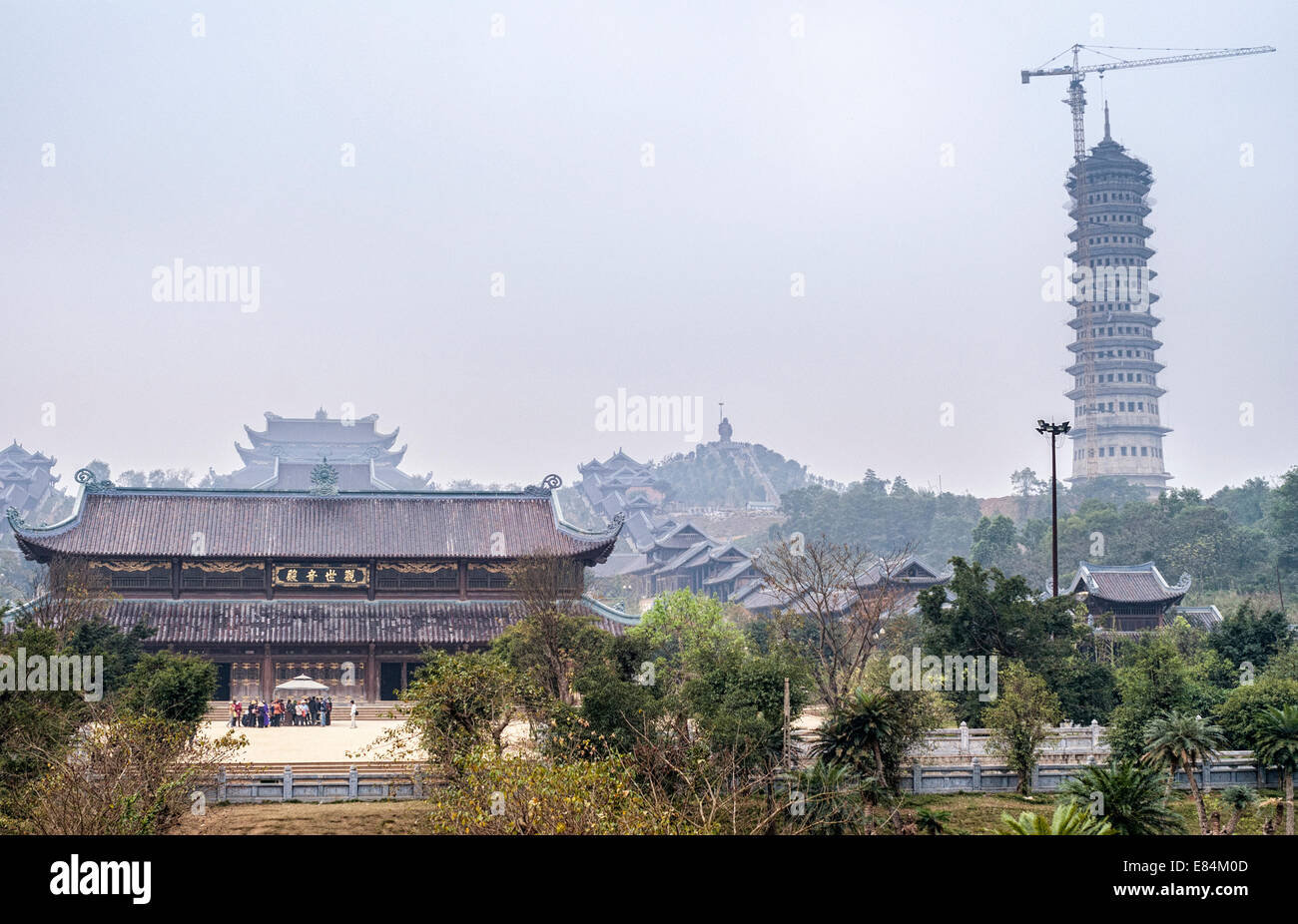 Gray morning skies over Chua Bai Dinh Buddhist Pagoda buildings Stock Photo