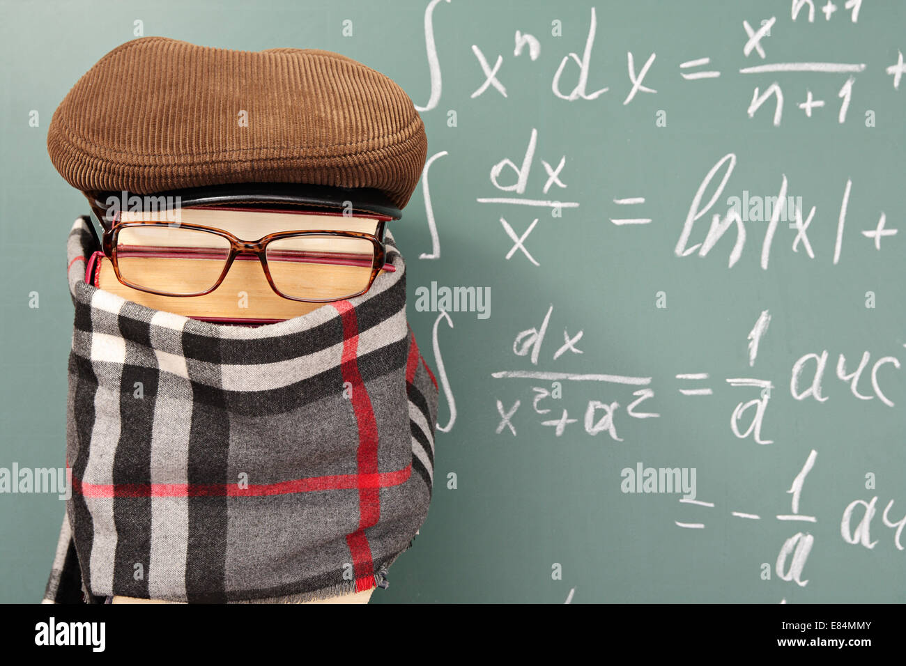 Unusual parody joke. Teacher before chalk board with integrals Stock