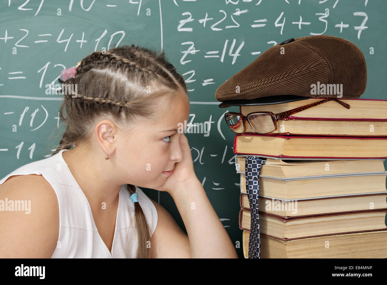 My teachers it is my books, schoolgirl looking into the eyes of his teacher Stock Photo