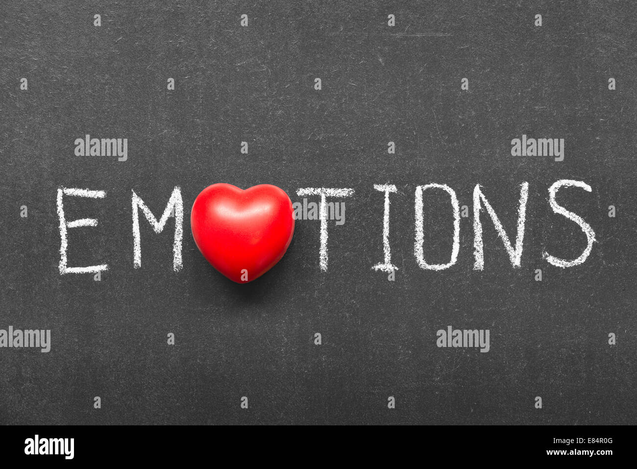 emotions word handwritten on chalkboard with heart symbol instead of O Stock Photo