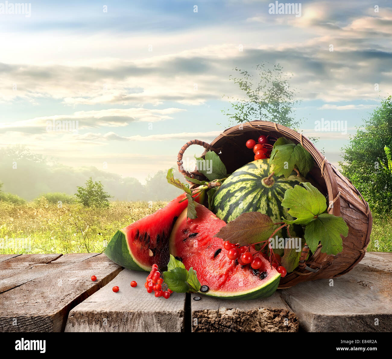 Watermelon in a basket and beautiful landscape Stock Photo