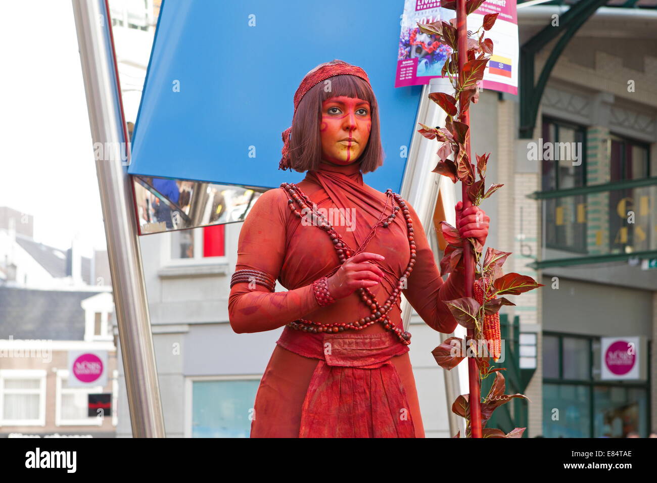 Arnhem, Netherlands - September 28, 2014: artist lady in red during world championships living statues in Arnhem Stock Photo