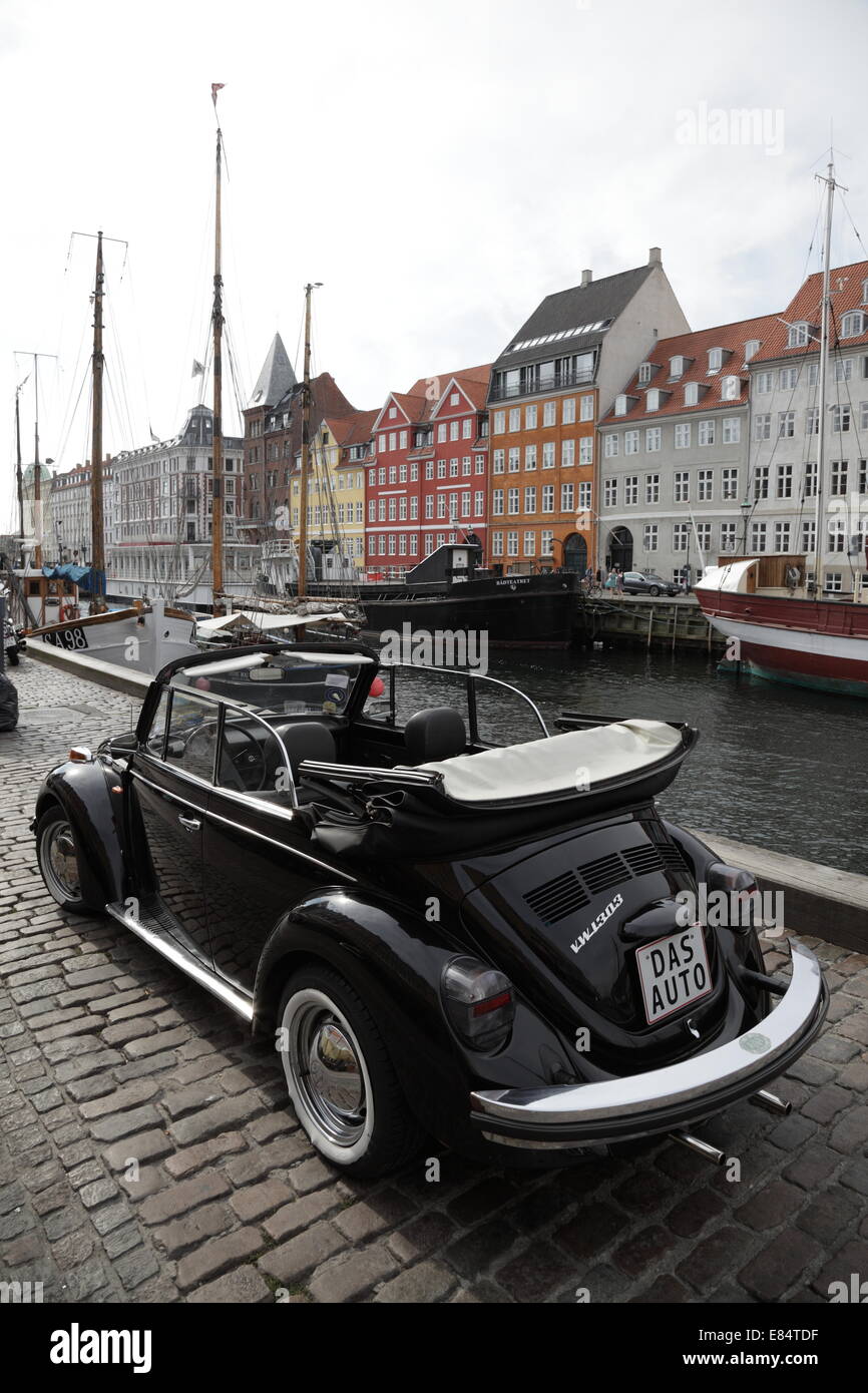 A classic black Volkswagen Beetle car in Nyhavn, Copenhagen, Denmark. Unique registration plate 'DAS AUTO' Stock Photo