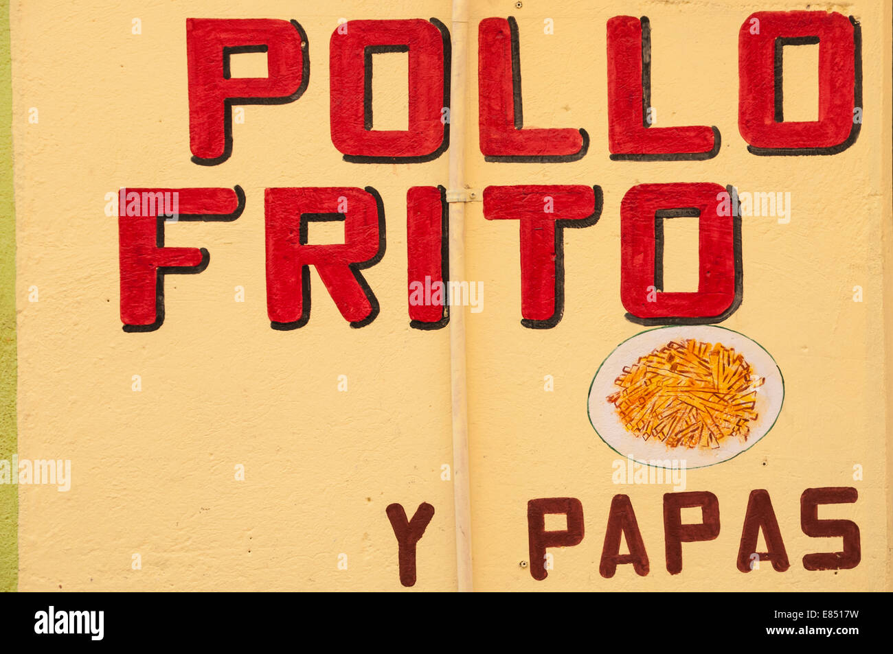 Pollo frito y papas (fried chicken and potatoes), pained sign on shop