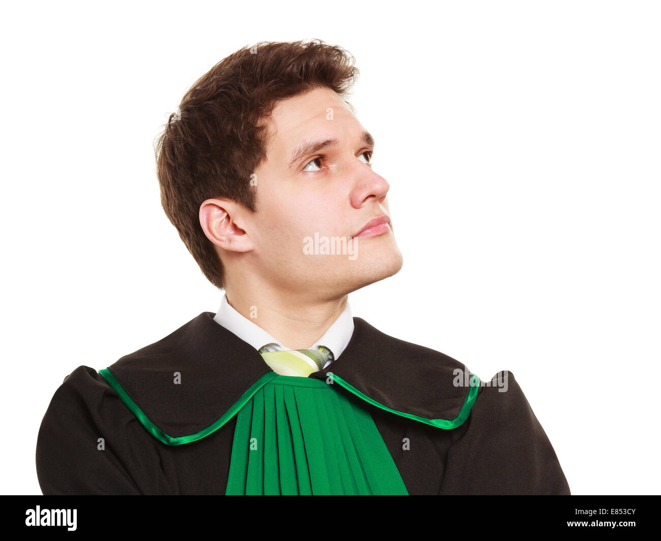 Law court and justice. Young pensive man lawyer attorney in polish (Poland) black green gown isolated on white. Occupation. Stock Photo