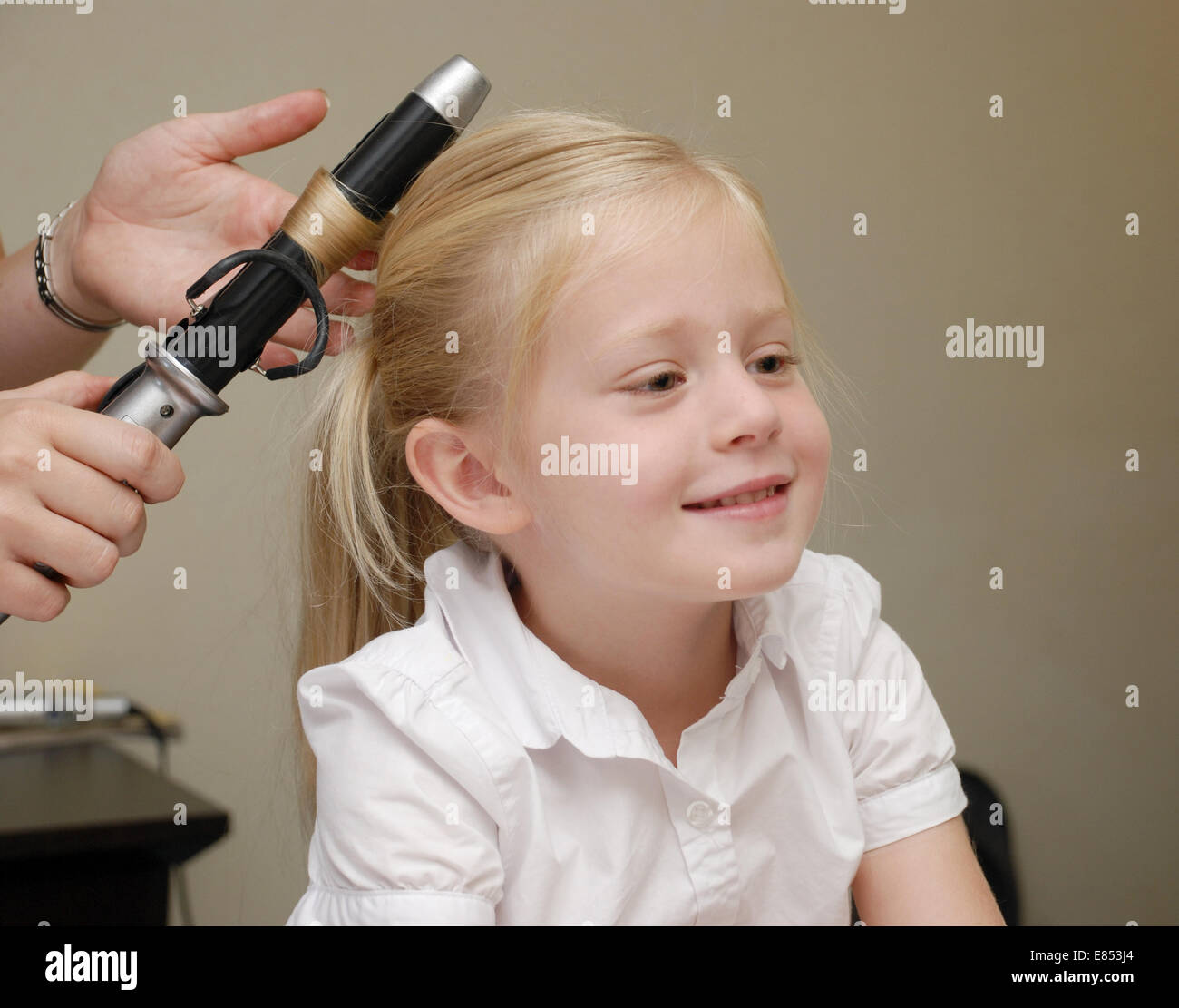 Young girl getting her hair fixed for a wedding Stock Photo