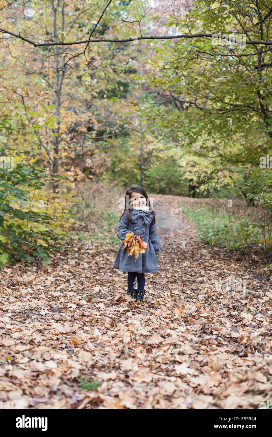 little girl in autumn park Stock Photo - Alamy