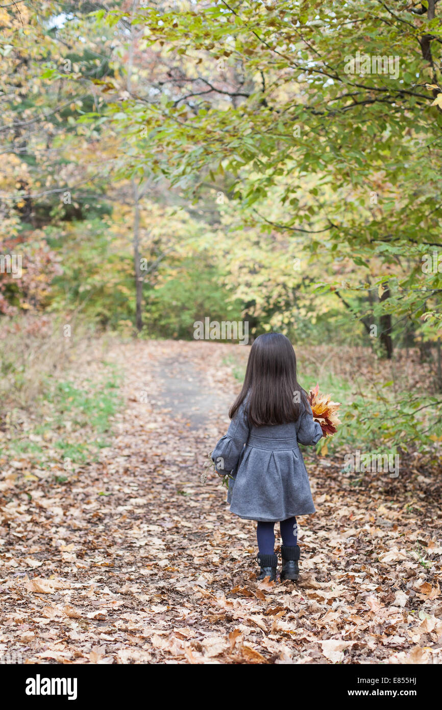 little girl in autumn park Stock Photo - Alamy