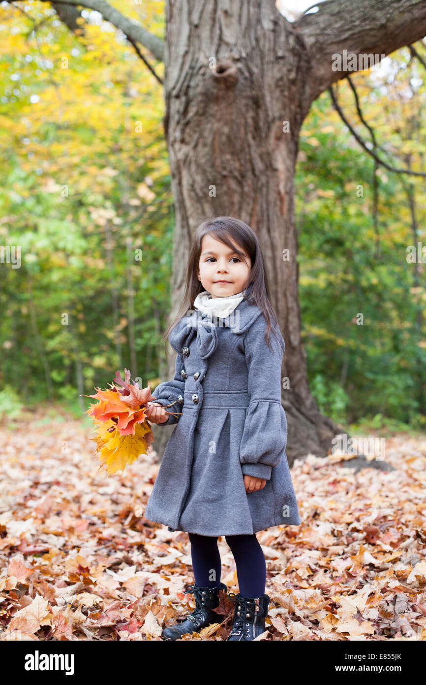 little girl in autumn park Stock Photo - Alamy