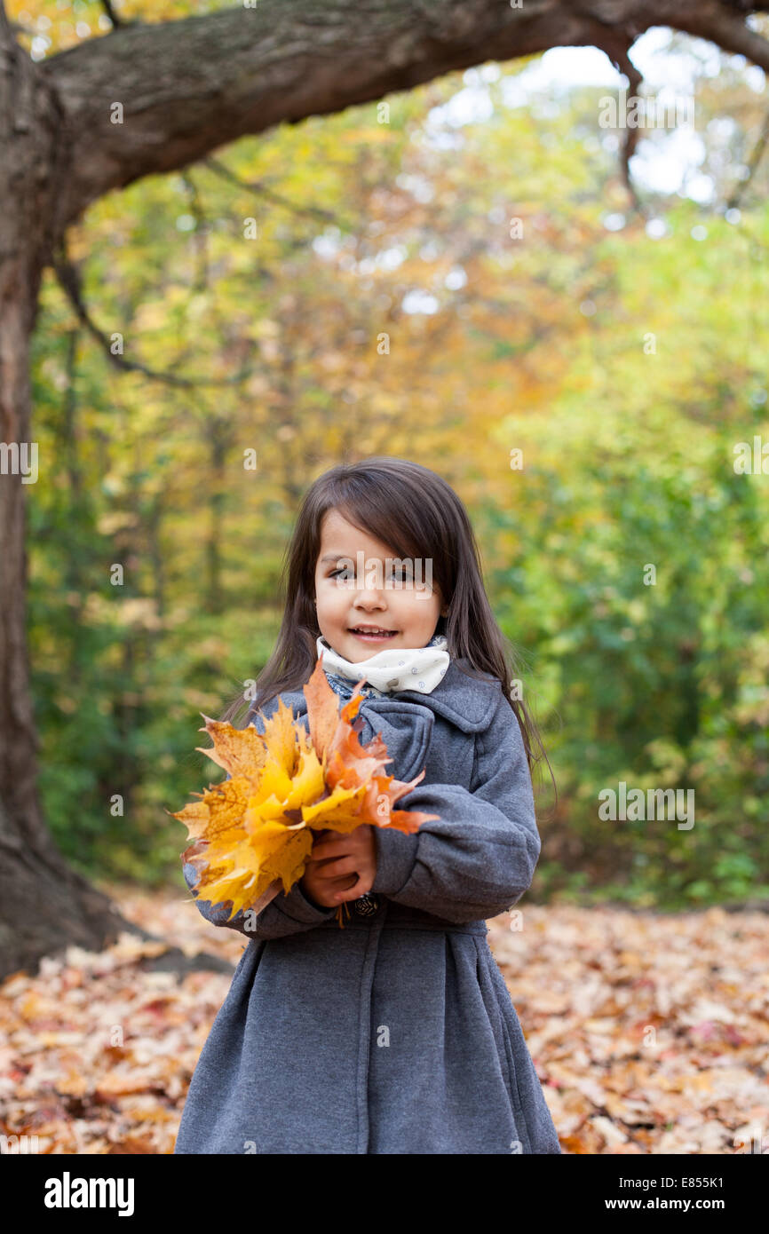 little girl in autumn park Stock Photo - Alamy