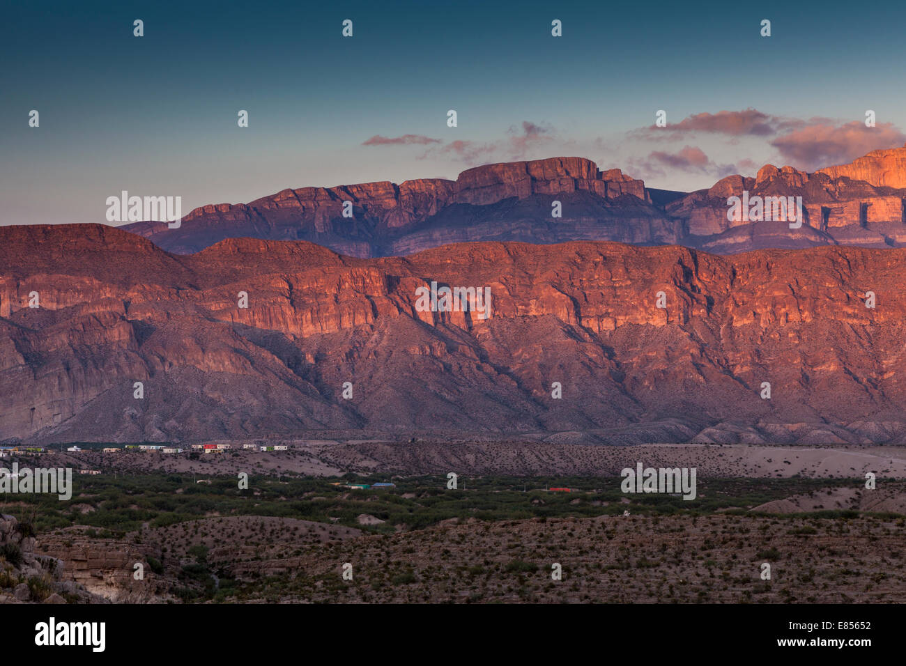 Sunset over the village of Boquillas in Boquillas Canyon with a backdrop of the Sierra del Carmen mountains of Mexico. Stock Photo