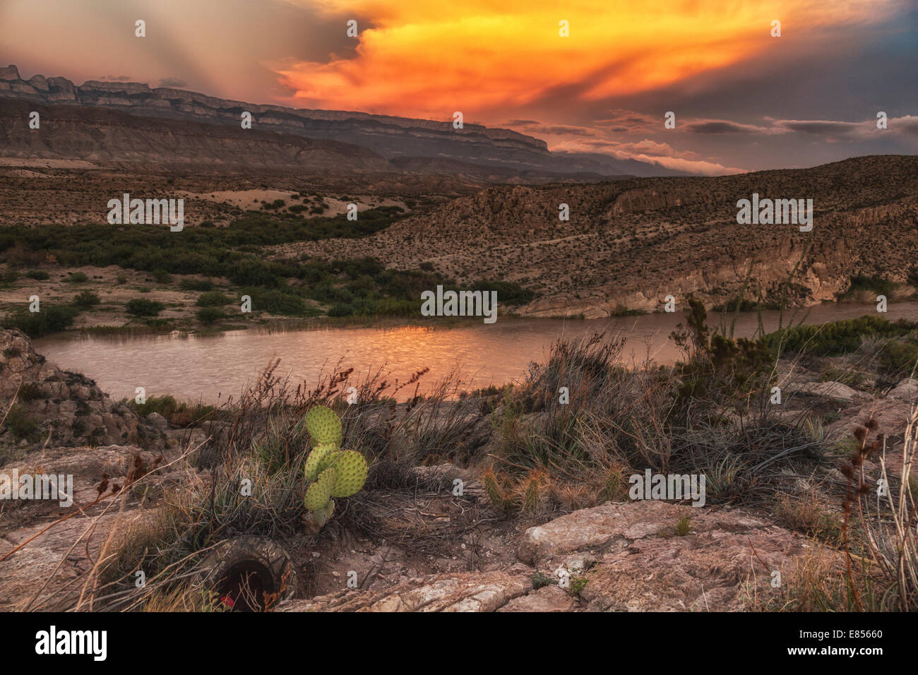 Sunset reflecting in the Rio Grande River in Boquillas Canyon with a backdrop of the Sierra del Carmen Mountains of Mexico. Stock Photo