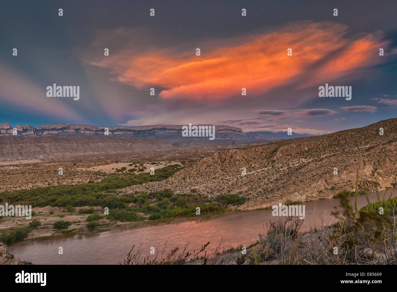 Sunset reflecting in the Rio Grande River in Boquillas Canyon with a backdrop of the Sierra del Carmen Mountains of Mexico. Stock Photo