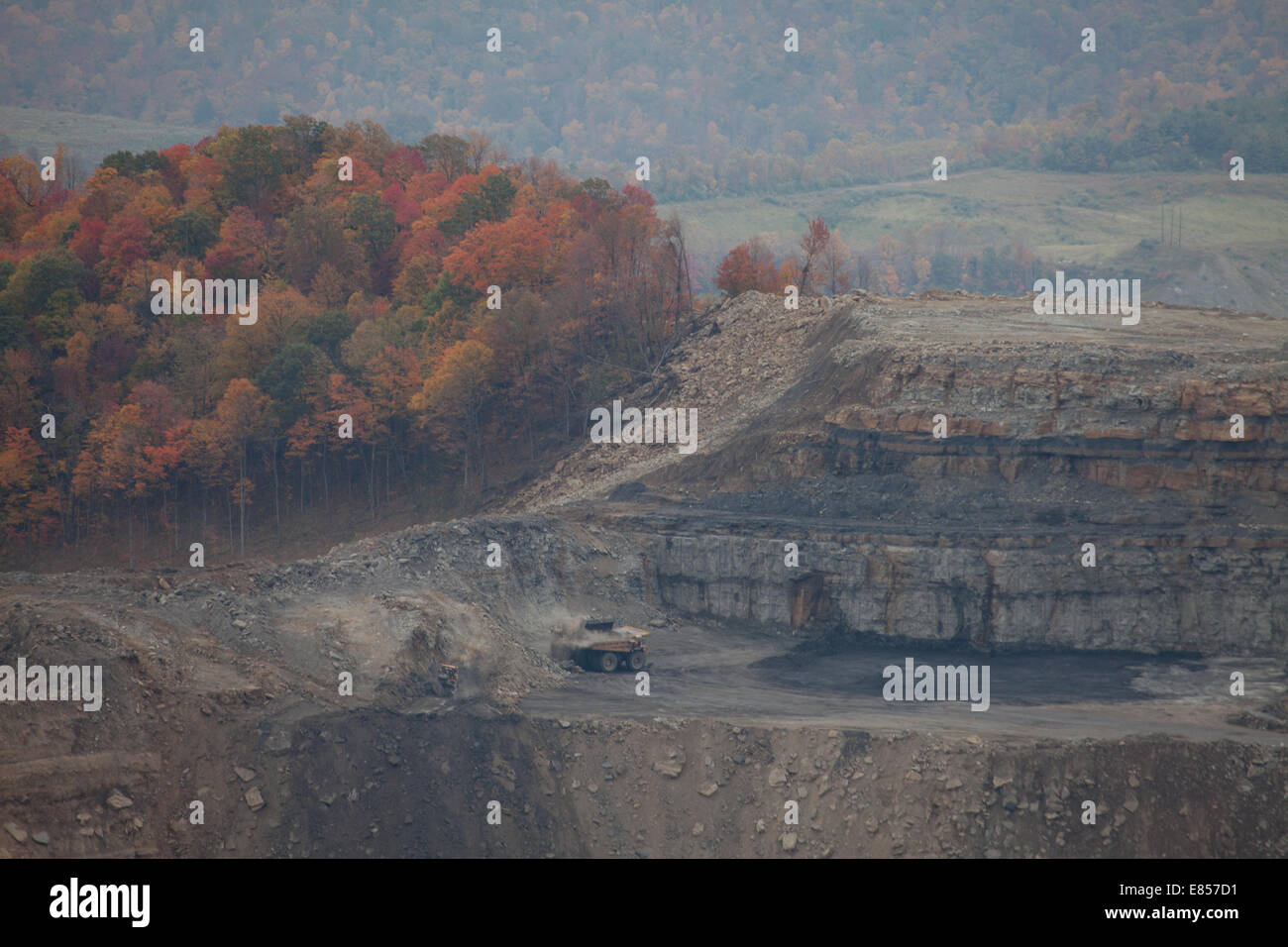 Coal mining dump truck excavating mountaintop, Appalachia, Wise County, Virginia, USA, high