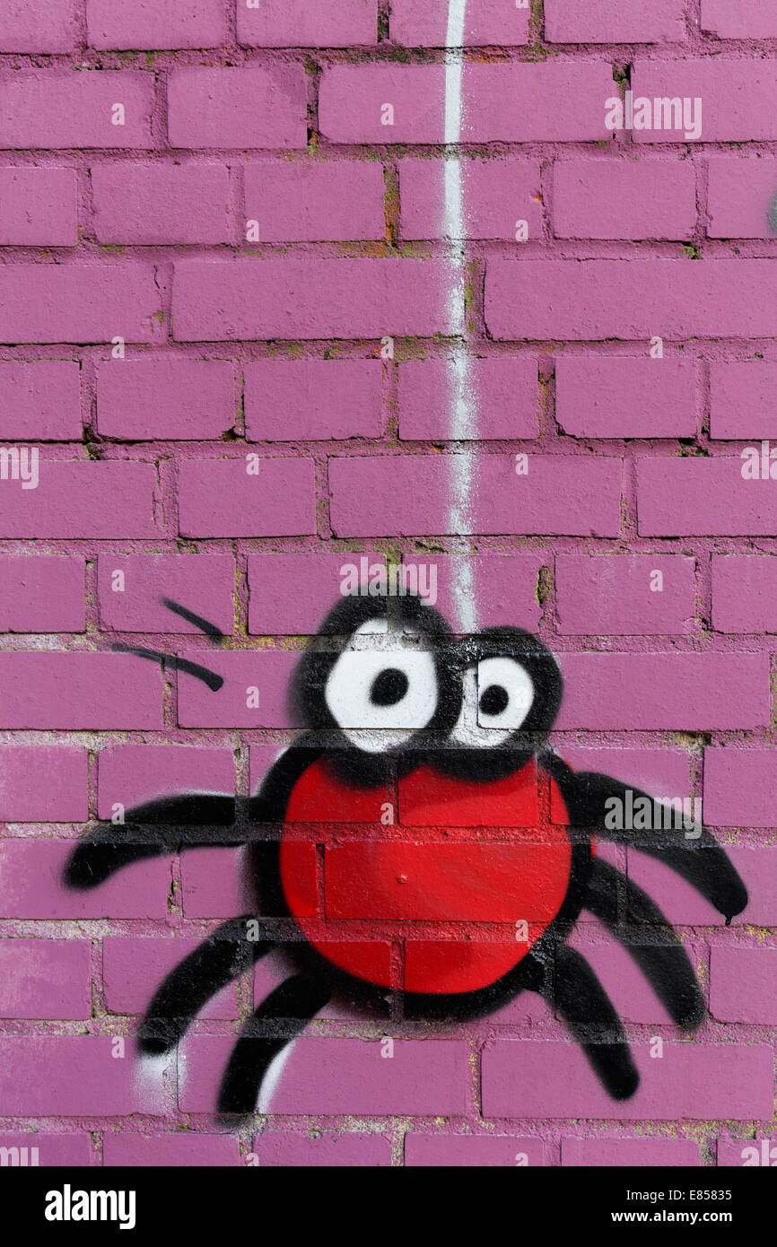 Spider figure descending on a web, mural, North Rhine-Westphalia, Germany Stock Photo