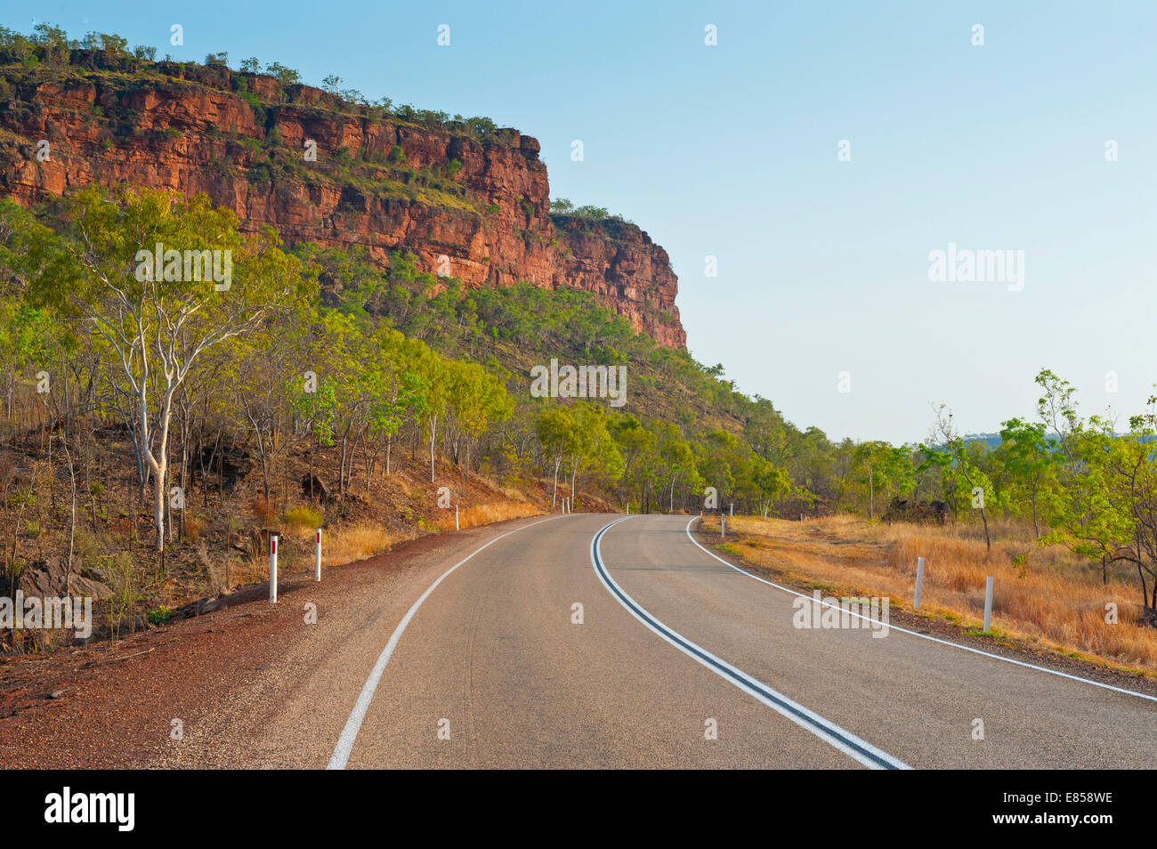 Road, red cliffs, Northern Territory, Australia Stock Photo