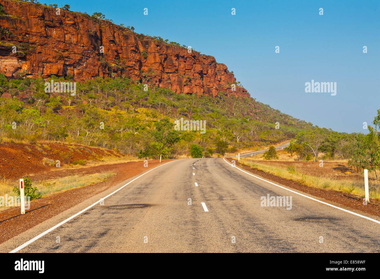 Road, red cliffs, Northern Territory, Australia Stock Photo