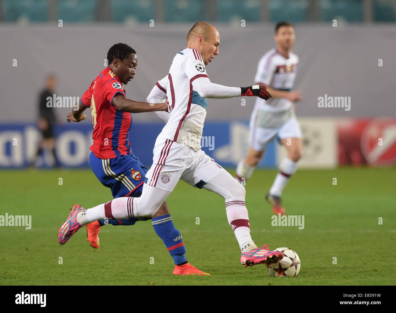 Moscow, Russia. 30th Sept, 2014.Arjen Robben (r) of Bayern Munich in action against Ahmed Musa of CSKA Moscow during the UEFA Champion League Group E soccer match between CSKA Moscow and Bayern Munich at Arena Khimki in Moscow, Russia, 30 September 2014. Credit:  dpa picture alliance/Alamy Live News Stock Photo