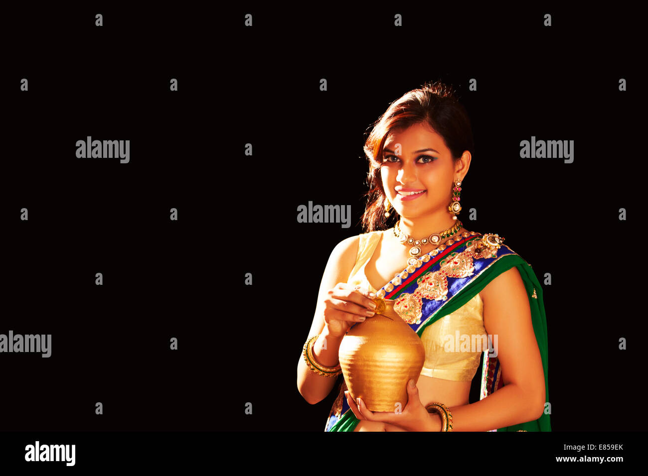indian ladies diwali Festival Money Piggy Bank Stock Photo - Alamy