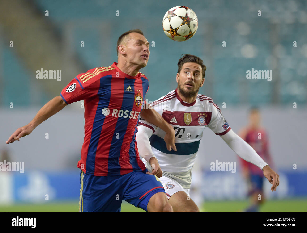 Moscow, Russia. 30th Sept, 2014.Claudio Pizarro (r) of Bayern Munich in action against Sergei Ignashevich of CSKA Moscow during the UEFA Champion League Group E soccer match between CSKA Moscow and Bayern Munich at Arena Khimki in Moscow, Russia, 30 September 2014. Credit:  dpa picture alliance/Alamy Live News Stock Photo