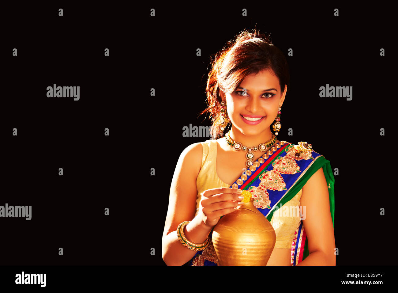 indian ladies diwali Festival Money Piggy Bank Stock Photo - Alamy