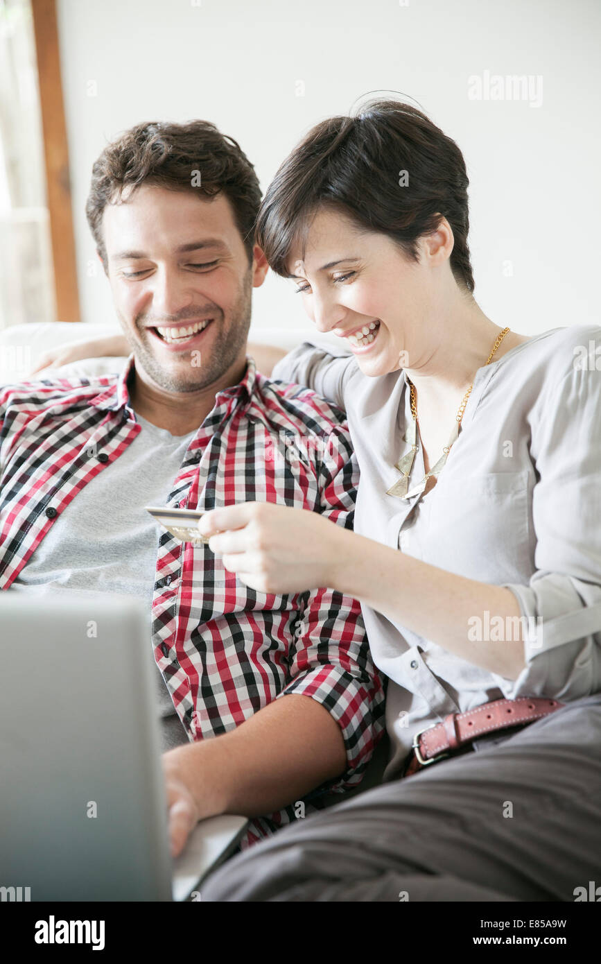 Couple using credit card to shop online Stock Photo Alamy