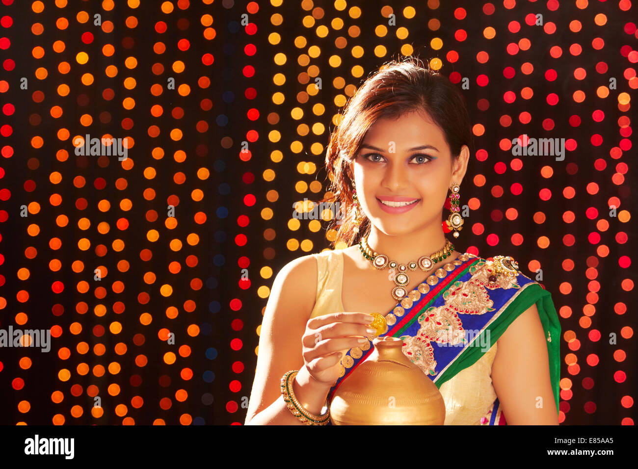 indian ladies diwali Festival Money Piggy Bank Stock Photo - Alamy