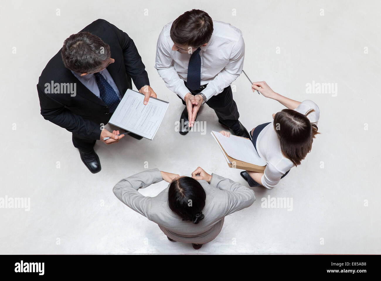 Executives in meeting, overhead view Stock Photo