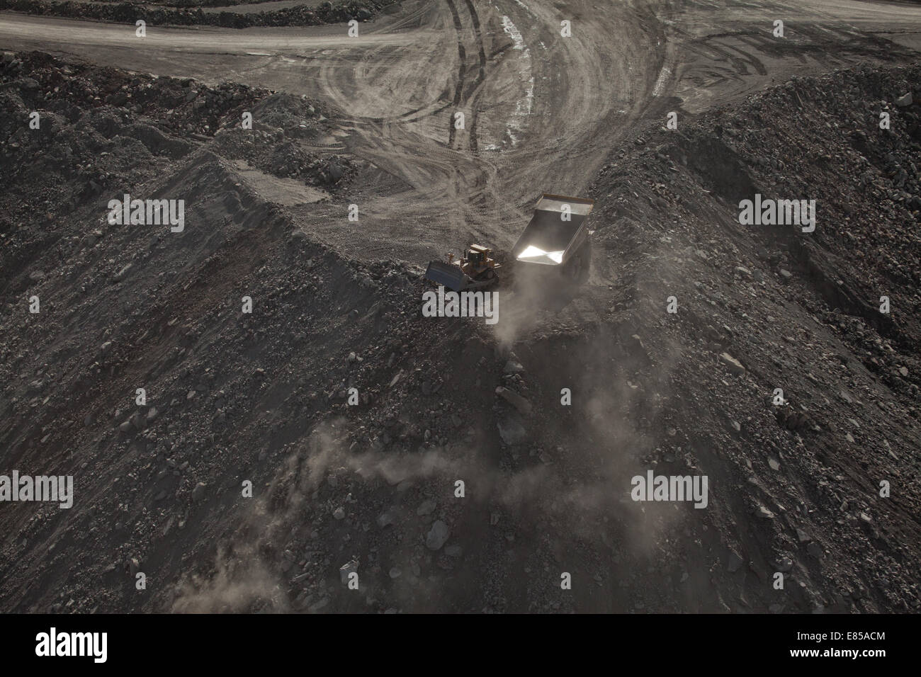 Coal mining diggers and dump truck excavating mountaintop, Appalachia, Wise County, Virginia