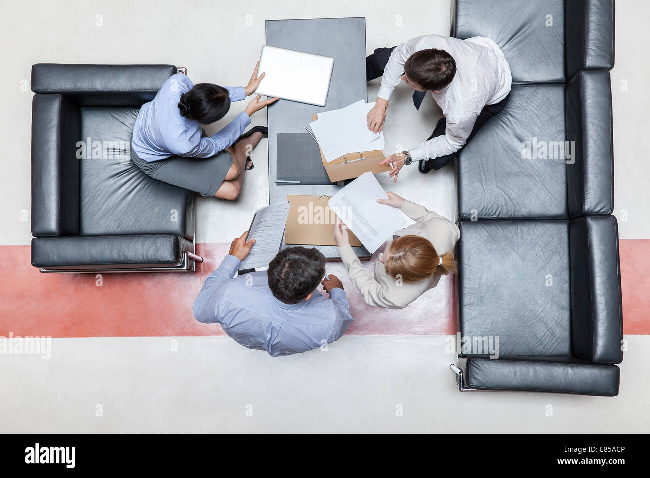 Executives in meeting, overhead view Stock Photo