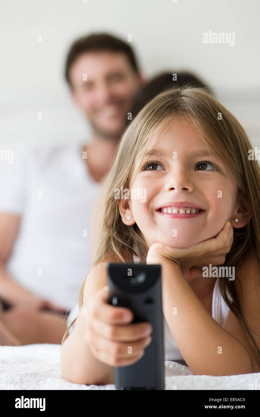 Little girl holding remote control Stock Photo