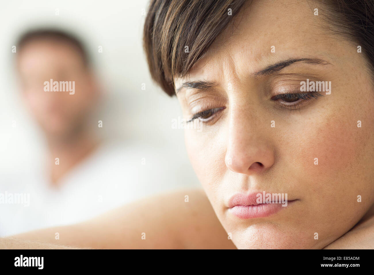 Woman contemplative and withdrawn after disagreement with husband Stock Photo