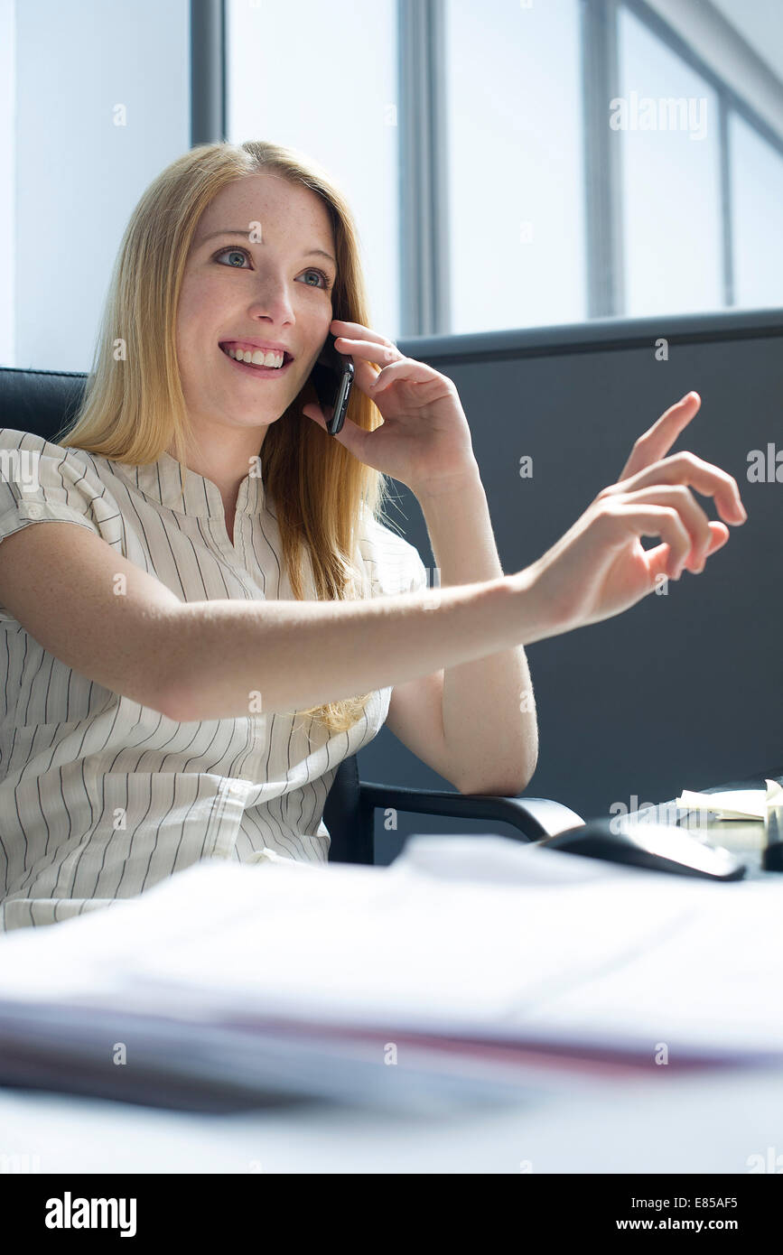 Office worker taking important phone call on smartphone Stock Photo Alamy