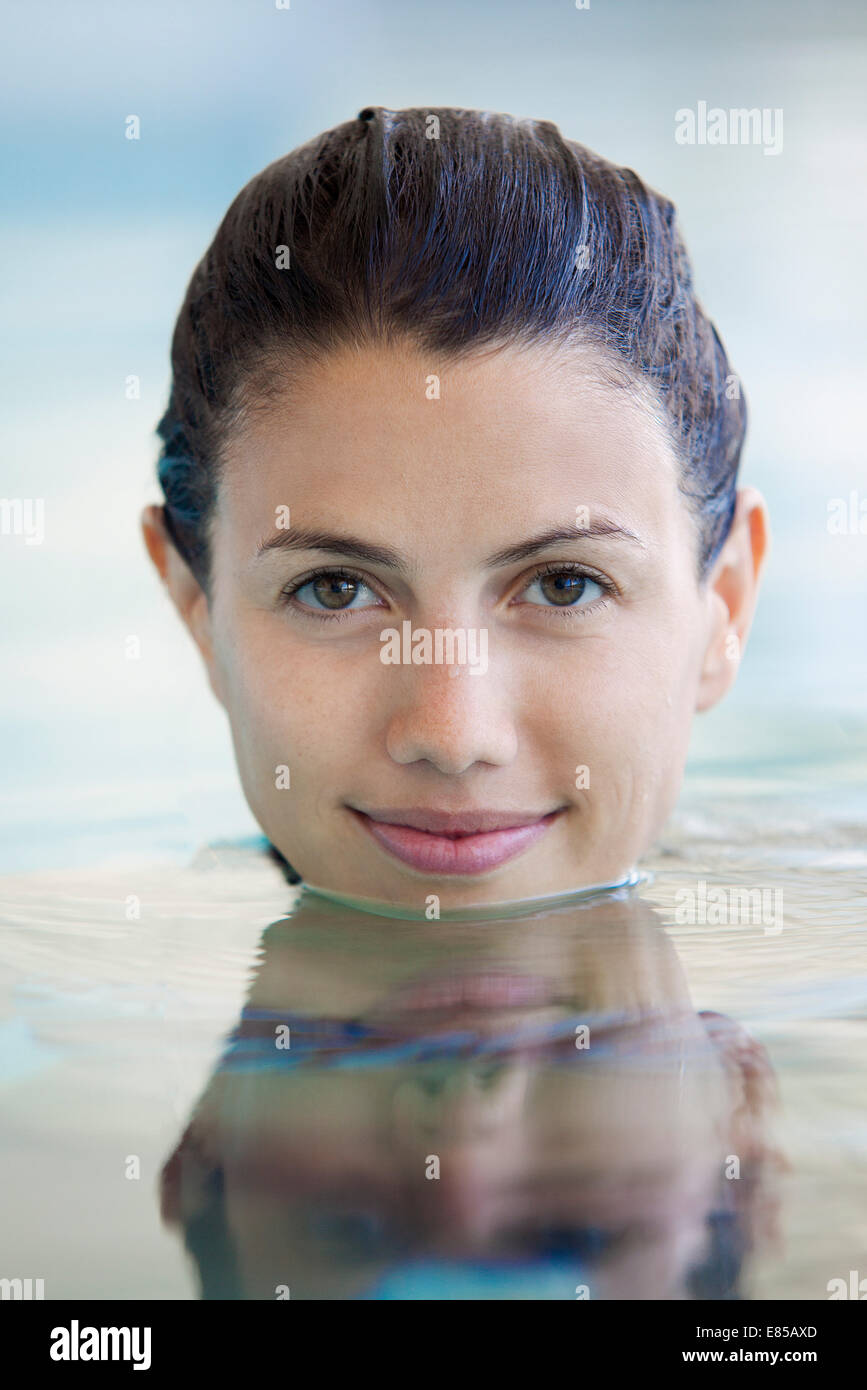 Young Woman Swimming Underwater In Pool Stock Photo