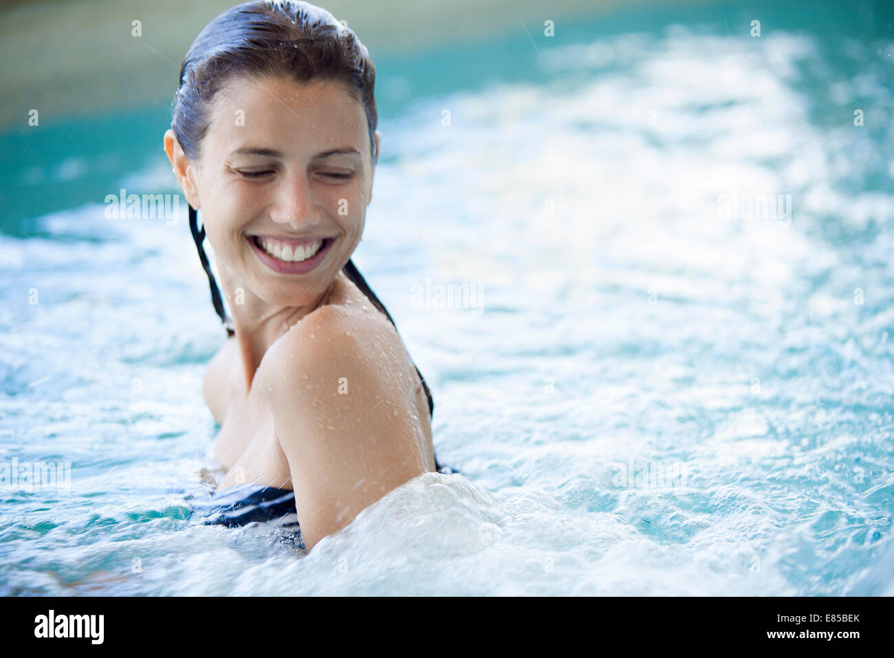 Woman swimming in pool Stock Photo