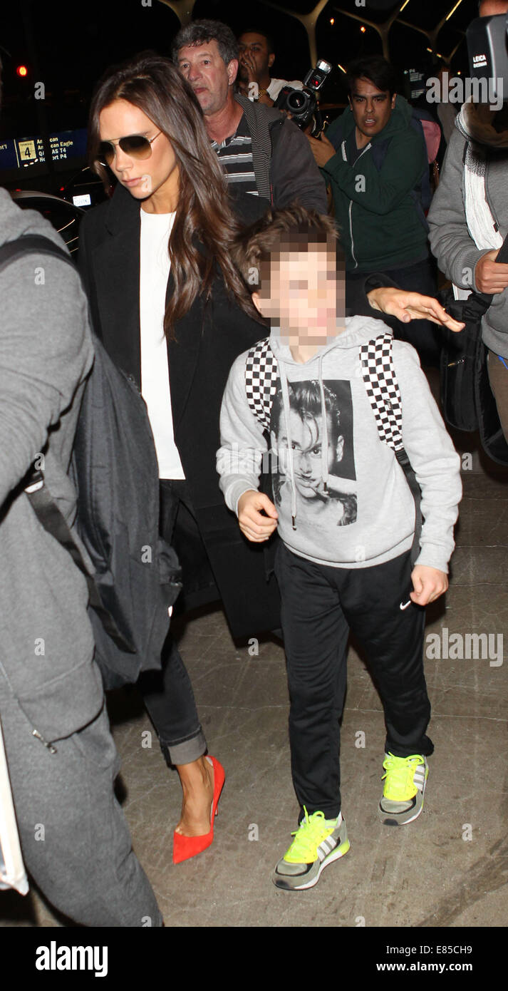 Victoria Beckham with her children at Los Angeles International Airport (LAX)  Featuring: Victoria Beckham,Cruz Beckham Where: Los Angeles, California, United States When: 29 Mar 2014 Stock Photo