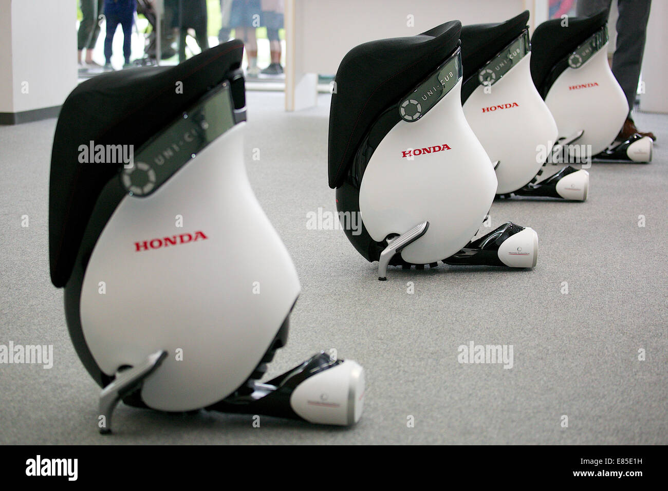Tokyo, Japan. 1st October, 2014. For the first time visitors can drive the Honda's personal mobility inside the National Museum of Emerging Science and Innovation (Miraikan) on October 1, 2014 in Tokyo, Japan. The rental cost is 620 JPY (5.66 USD) for adults and 210 JPY (1.92USD) for under 18 years from October 1 to March 31, 2015. According to the Honda staff UNI-CUB B can be used inside the buildings such as museums, airports, universities and other business places. Credit:  Rodrigo Reyes Marin/AFLO/Alamy Live News Stock Photo