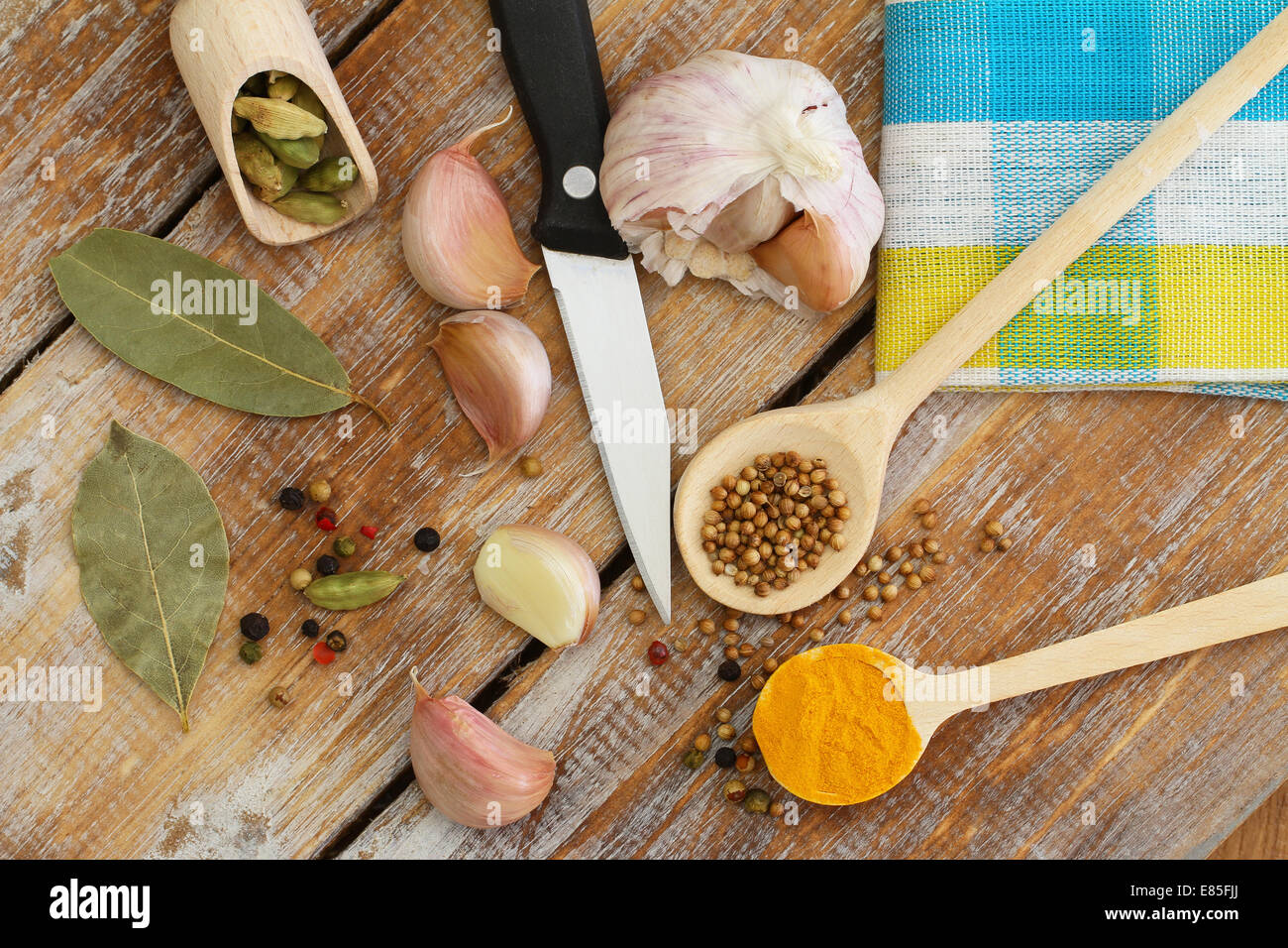 Cooking ingredients and spices on wooden surface Stock Photo