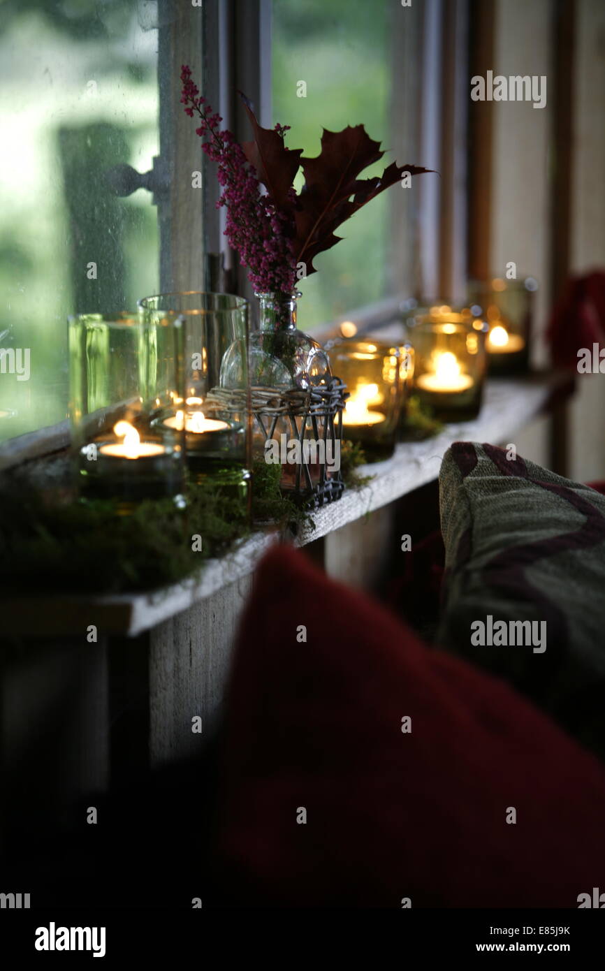 Candles on a window sill Stock Photo Alamy