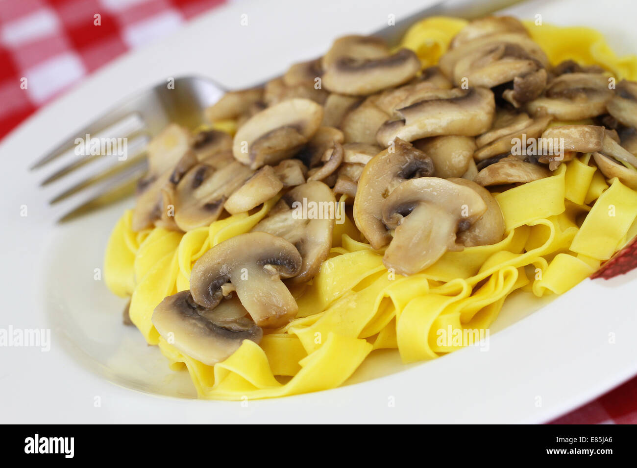 Pasta tagliatelle with mushrooms Stock Photo Alamy